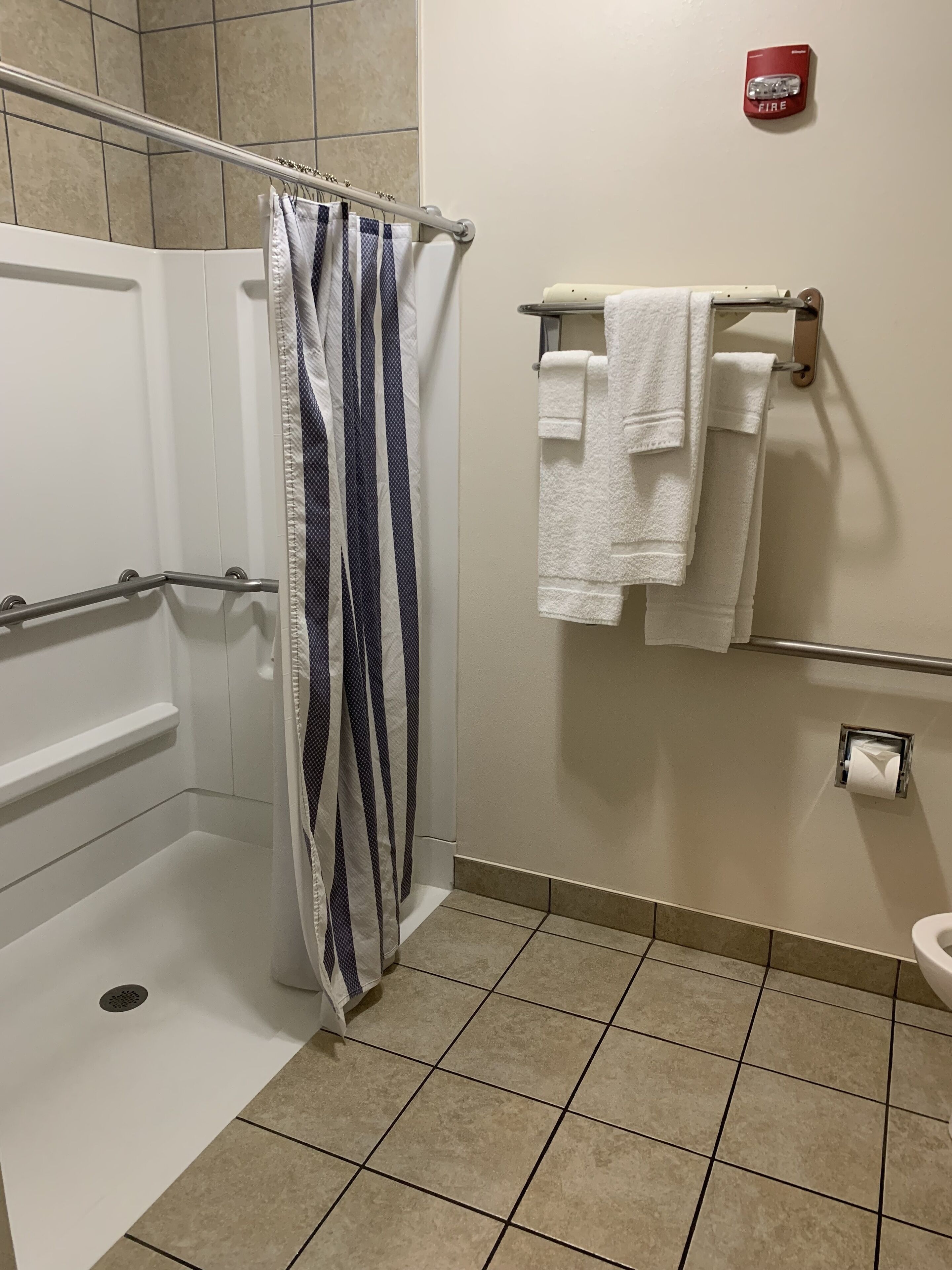 traditional room | bathroom | shower, hair dryer, towels