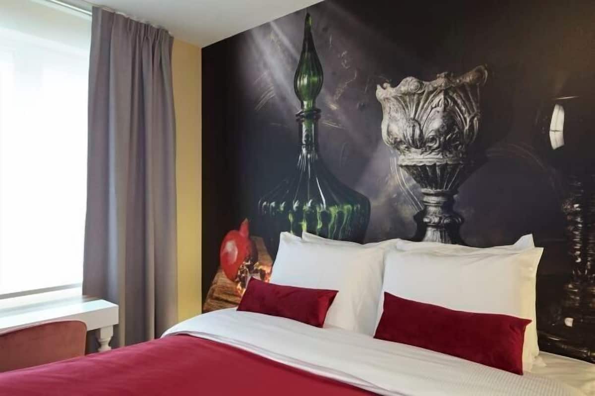 Luxe beddengoed, pillowtop-bedden, een minibar met enkele gratis items