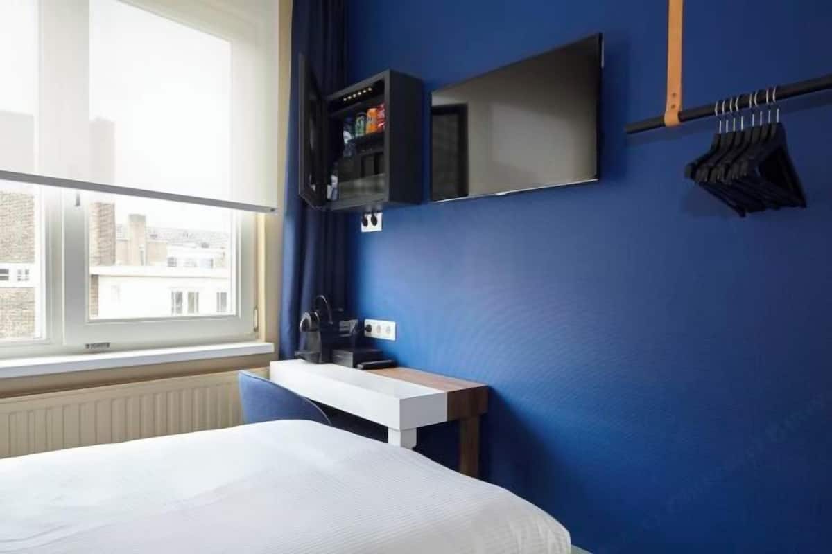 Luxe beddengoed, pillowtop-bedden, een minibar met enkele gratis items