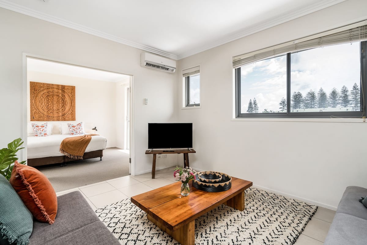 One Bedroom Deluxe Apartment | Living area | Flat-screen TV