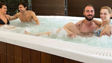 A hot tub with three people.