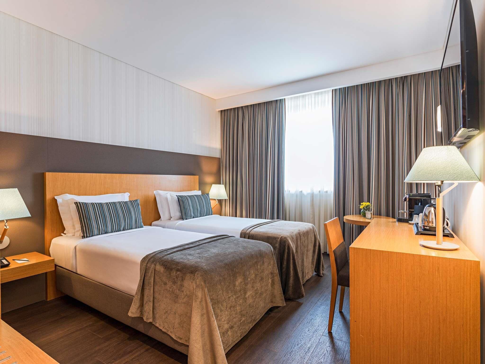 Hypo-allergenic bedding, in-room safe, desk, laptop workspace