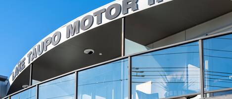 A building with a sign reading "LAKE TAUPO MOTOR INN".