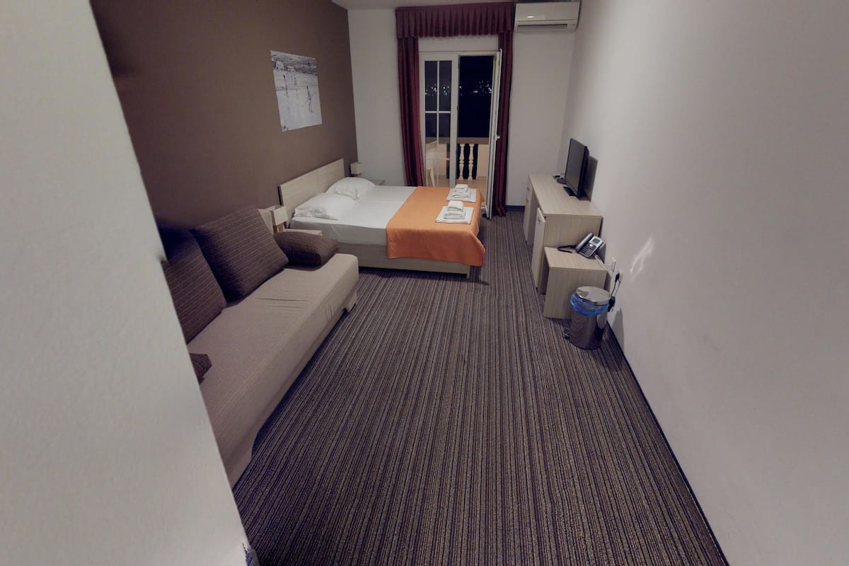 family room, balcony, sea view | minibar, in-room safe, desk, blackout curtains