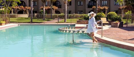 Outdoor pool, open 6 AM to 10 PM, pool umbrellas, sun loungers