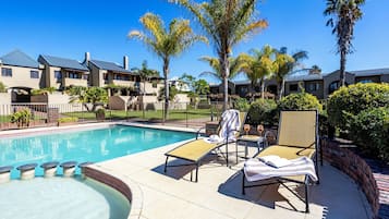 Outdoor pool, open 6 AM to 10 PM, pool umbrellas, pool loungers