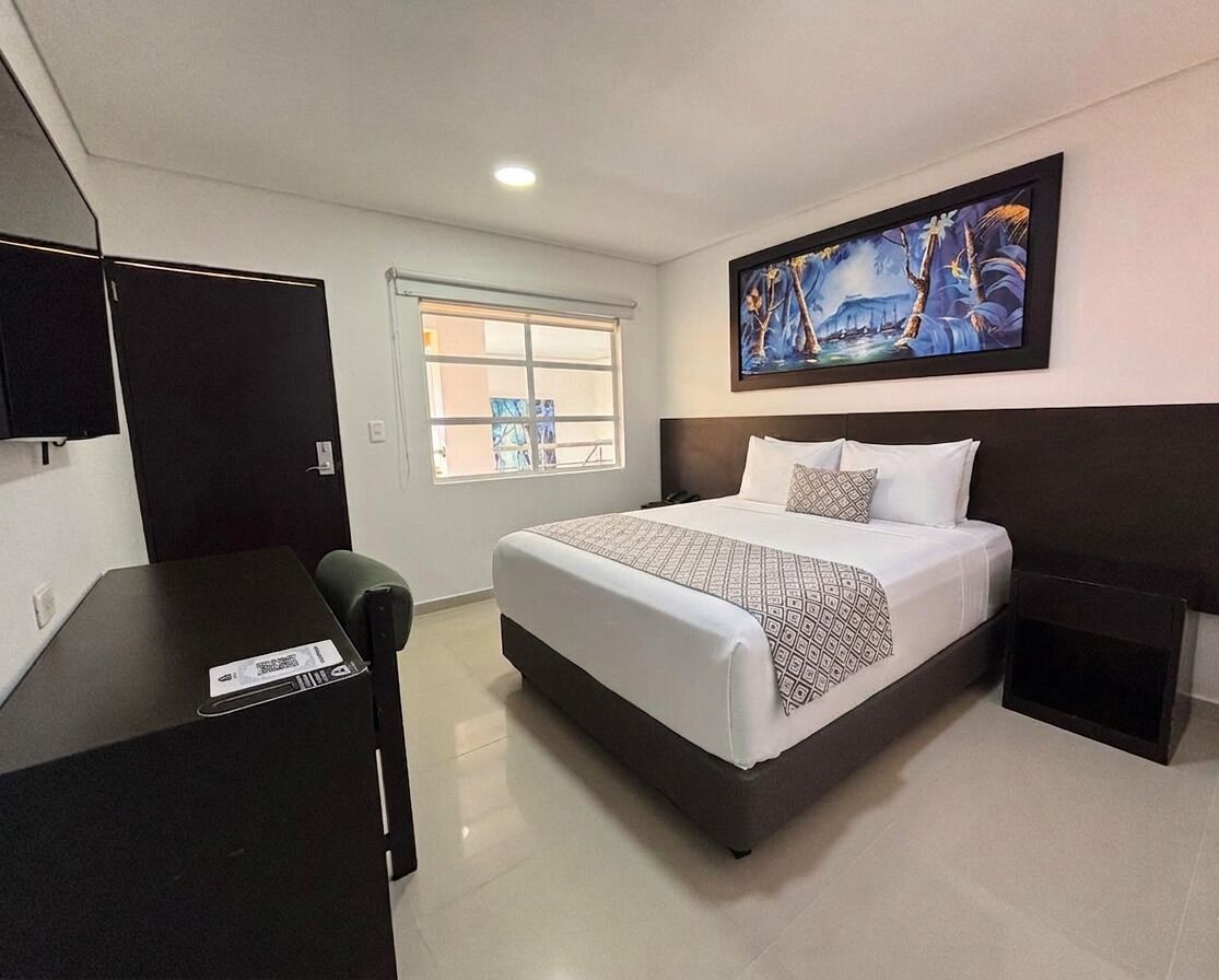 Habitación estándar doble de uso individual | Ropa de cama de alta calidad, edredones de plumas, minibar y caja fuerte