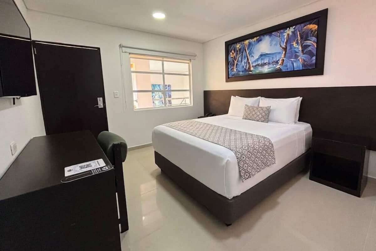 Habitación doble estándar de uso individual | Ropa de cama de alta calidad, edredón y minibar