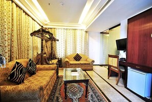 Suite, Accessible, City View | Living room | 32-inch LCD TV with satellite channels, TV - Hotel Zeeras (Varanasi)