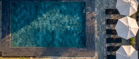 Seasonal outdoor pool, open 7:00 AM to 9:00 PM, pool umbrellas