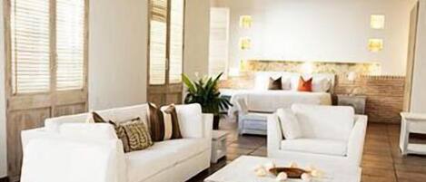 Junior Suite | Living area | 42-inch LCD TV with satellite channels, TV, iPod dock