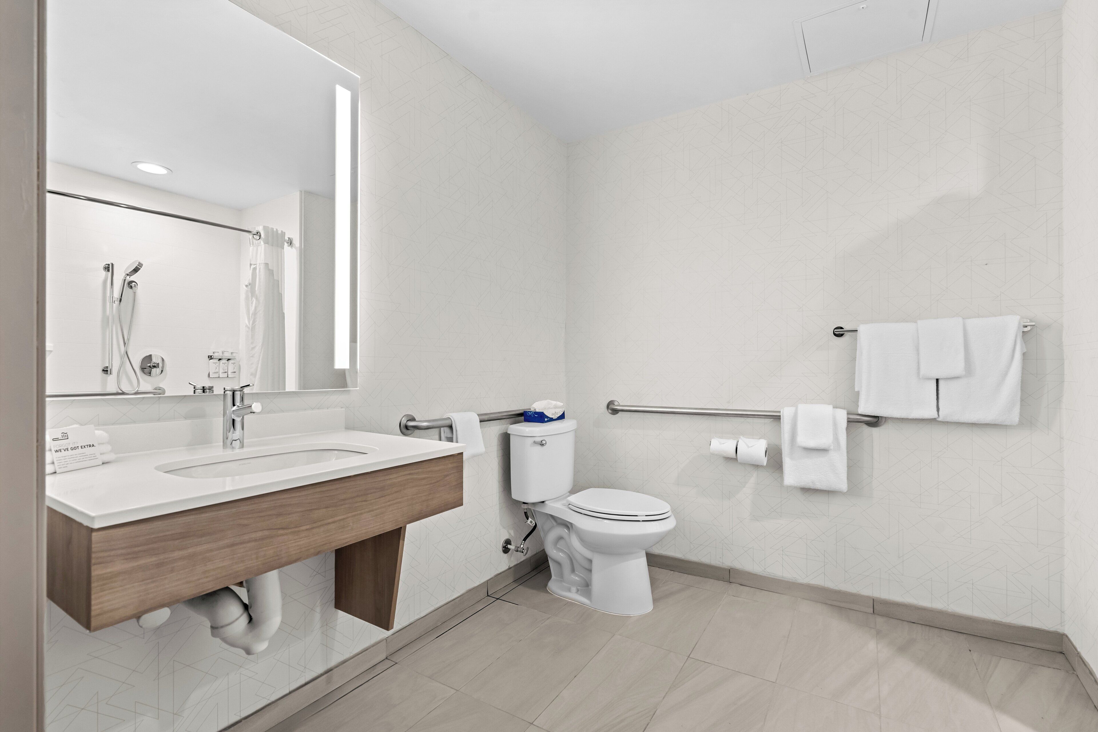 bathtub, hair dryer, towels