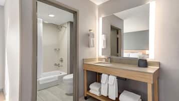 Combined shower/tub, designer toiletries, hair dryer, towels