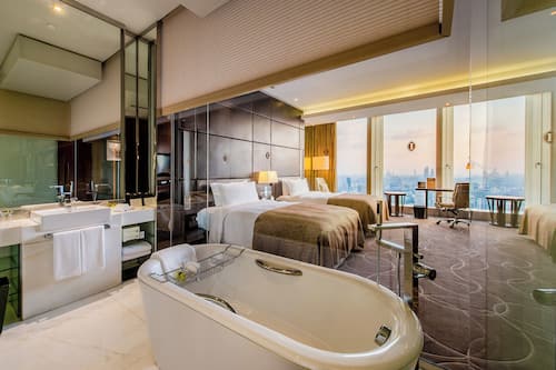 Premium bedding, down comforters, free minibar items, in-room safe
