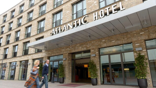 A multi-story hotel with a prominent "ATLANTIC HOTEL" sign above the entrance. - Atlantic Hotel Luebeck (Lübeck)