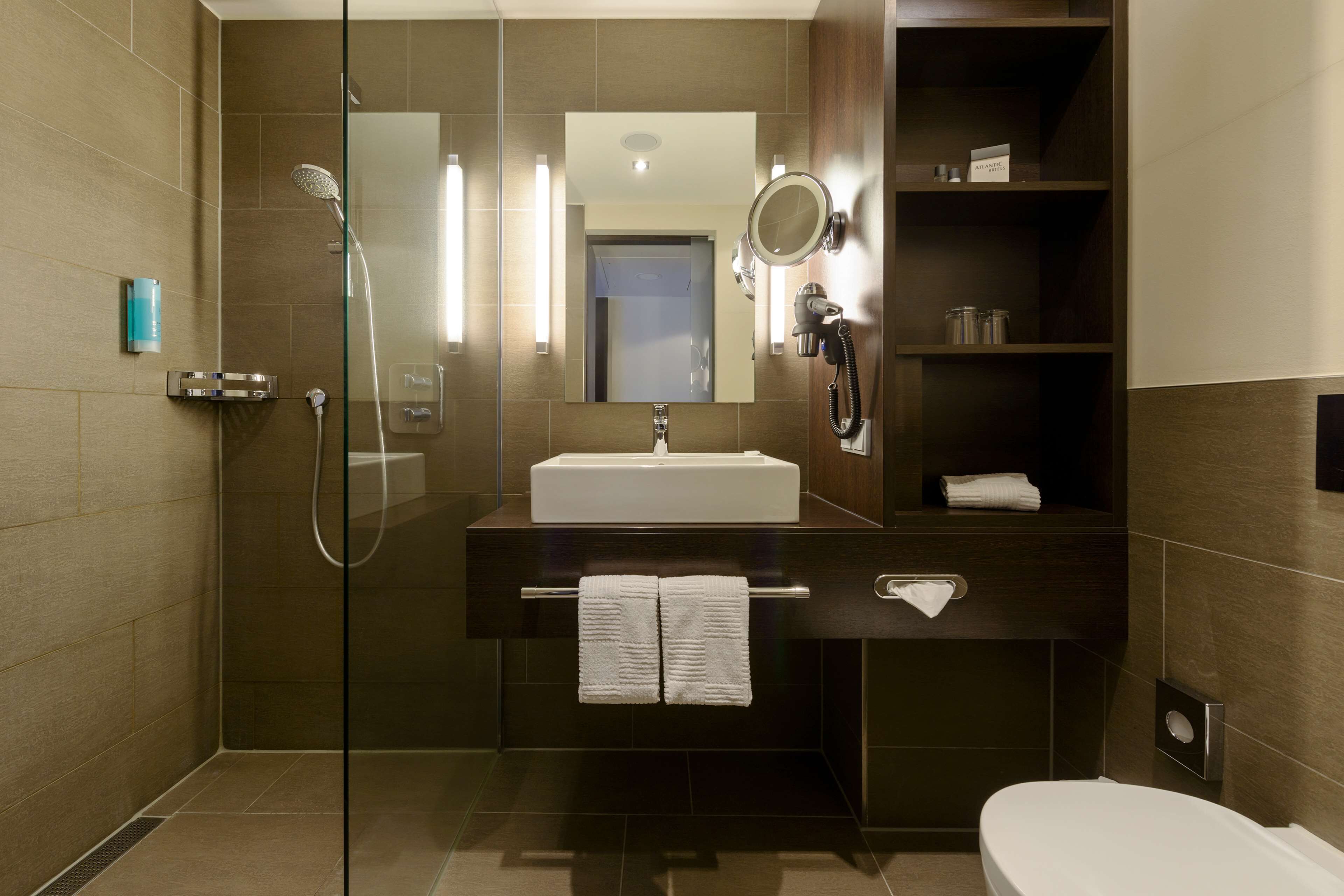 eco-friendly toiletries, hair dryer, bathrobes, towels