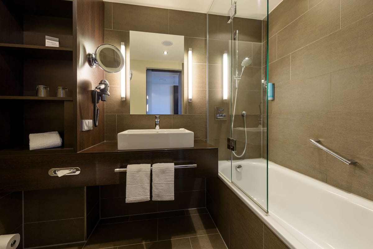 eco-friendly toiletries, hair dryer, bathrobes, towels