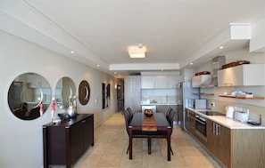 Standard Room, 1 Bedroom | Private kitchen | Full-size fridge, microwave, stovetop, cookware/dishes/utensils