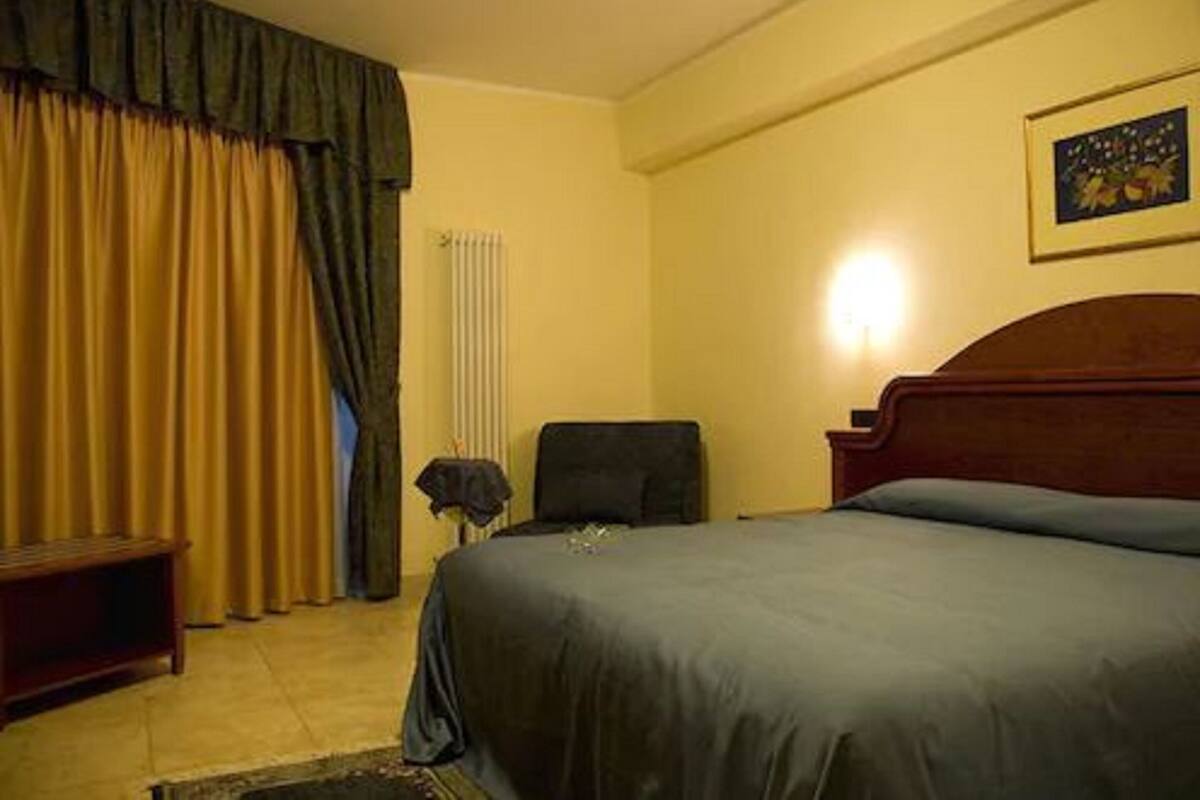 Triple Room | Minibar, in-room safe, desk, rollaway beds