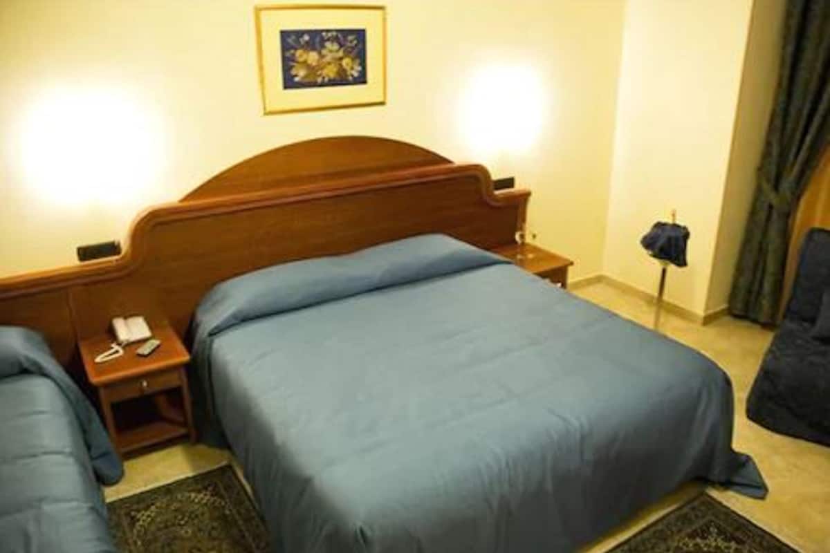 Quadruple Room | Minibar, in-room safe, desk, rollaway beds