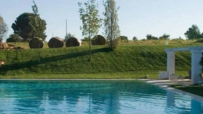 Seasonal outdoor pool, open 10:30 AM to 7:00 PM, sun loungers