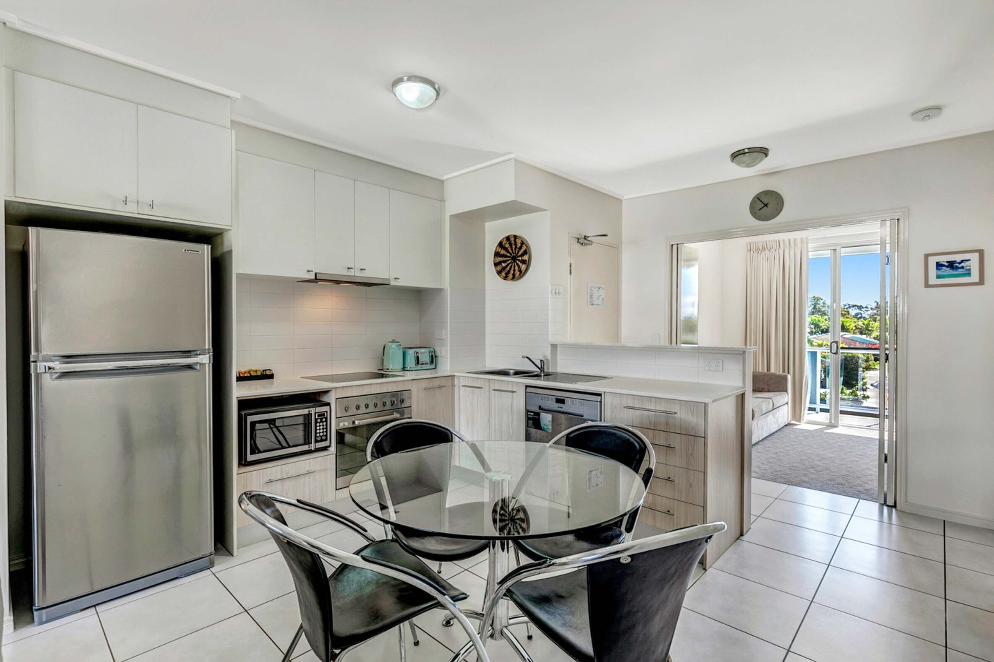 full-sized fridge, microwave, stovetop, dishwasher