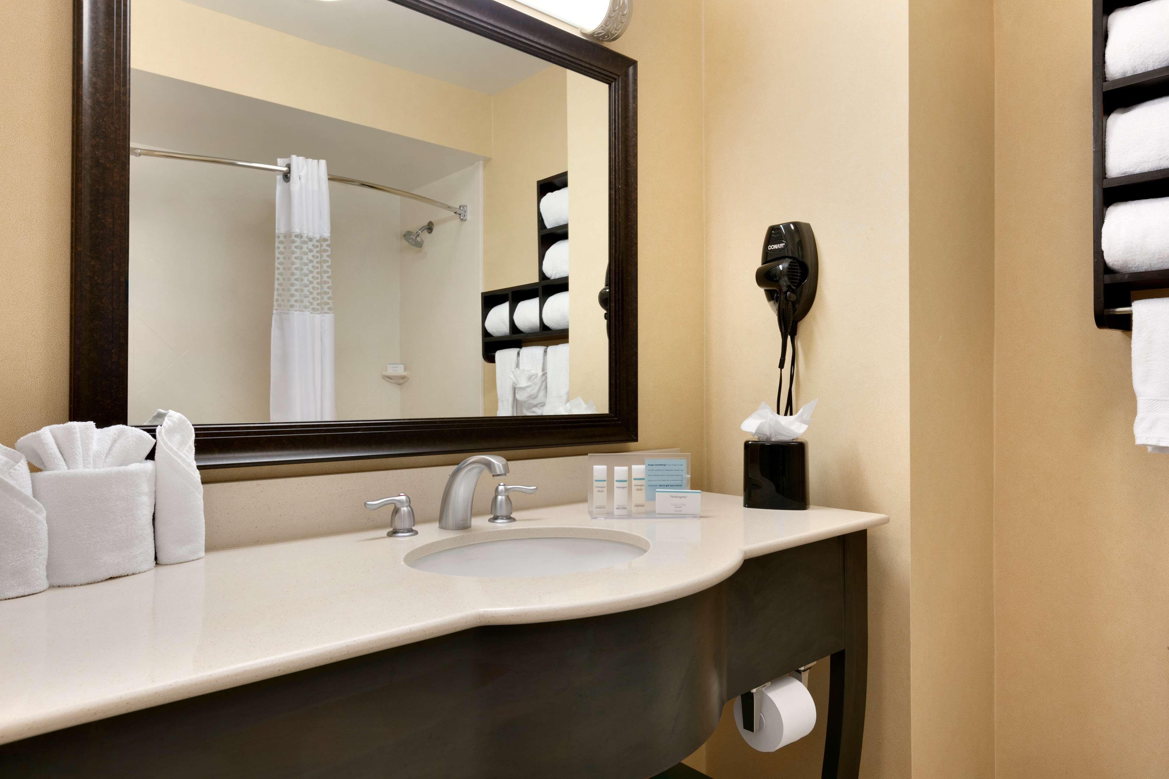 combined shower/bathtub, designer toiletries, hair dryer, towels