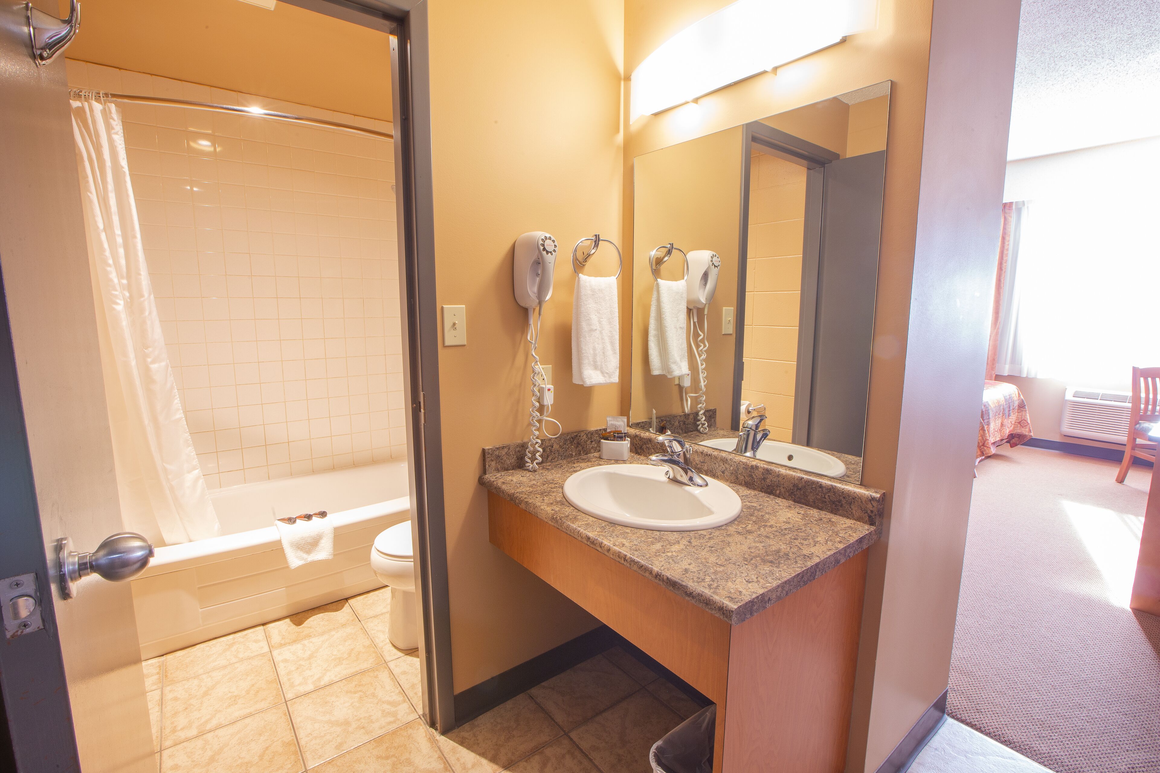 shower, rainfall showerhead, hair dryer, towels