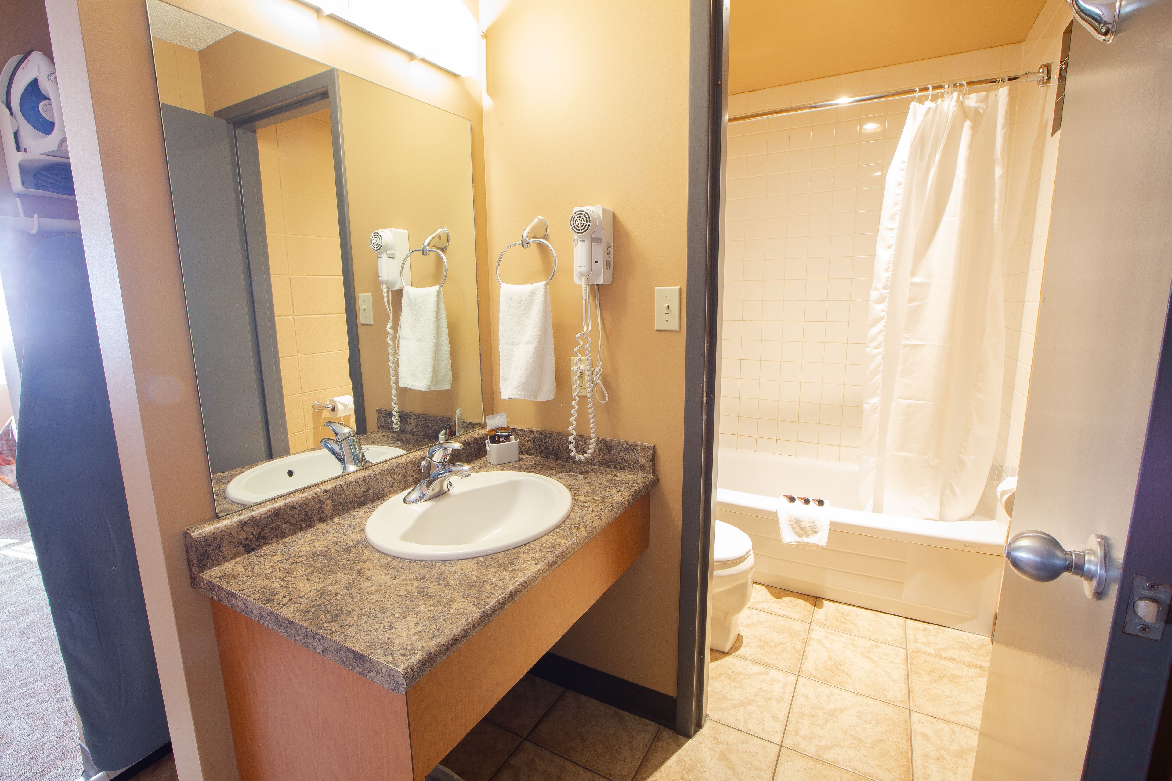 shower, rainfall showerhead, hair dryer, towels