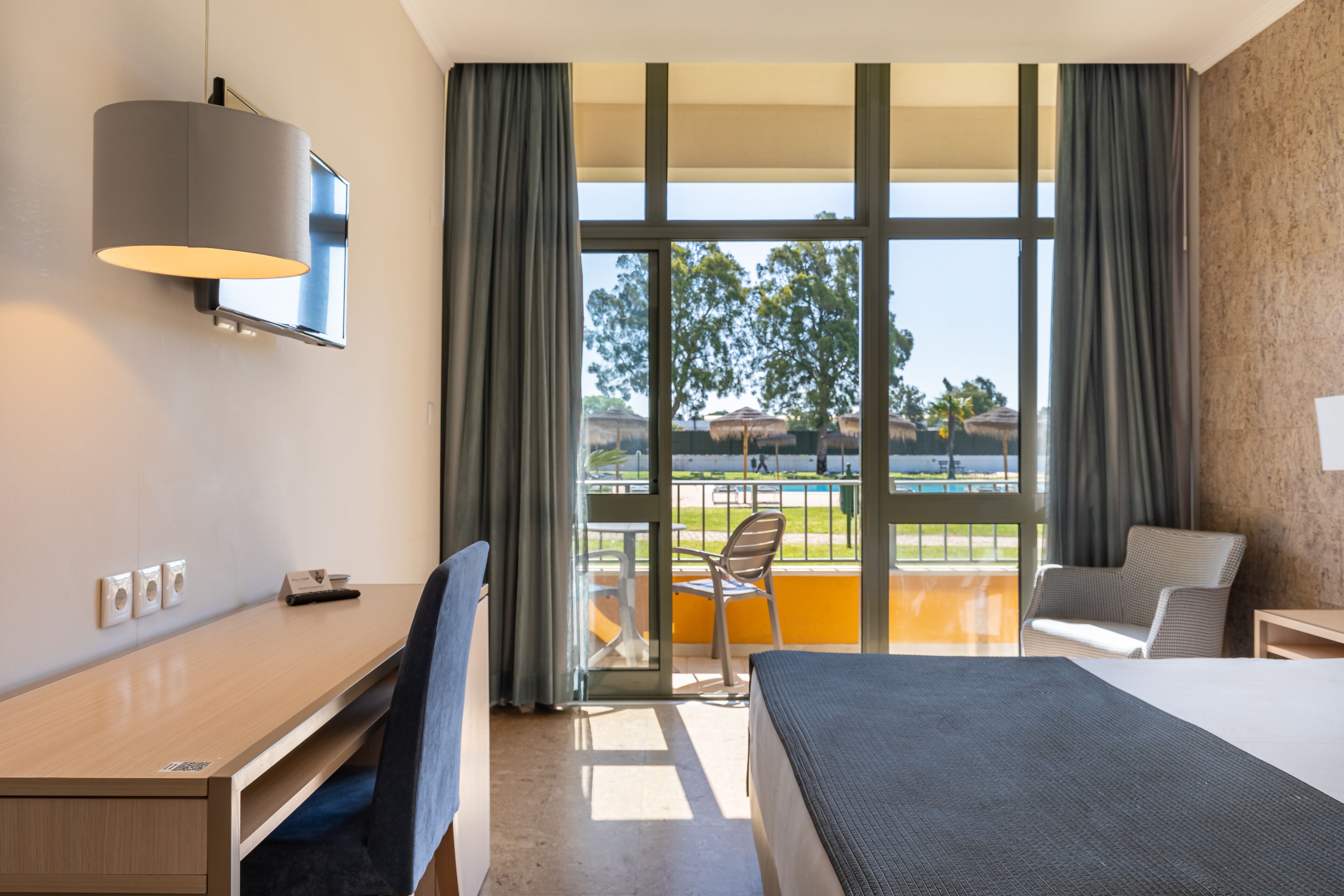 double room, pool view | minibar, in-room safe, individually decorated, individually furnished