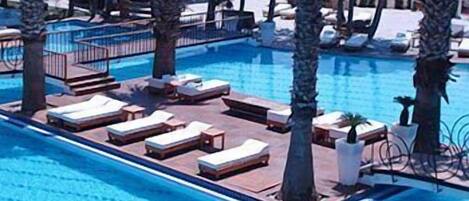 Indoor pool, outdoor pool, pool umbrellas, sun loungers