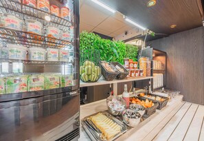 A breakfast buffet with various food items and beverages.