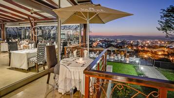 Lunch, dinner served; African cuisine, pool views