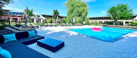 Seasonal outdoor pool, pool umbrellas, pool loungers