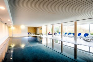 Indoor pool, open 7:00 AM to 9:30 PM, pool loungers