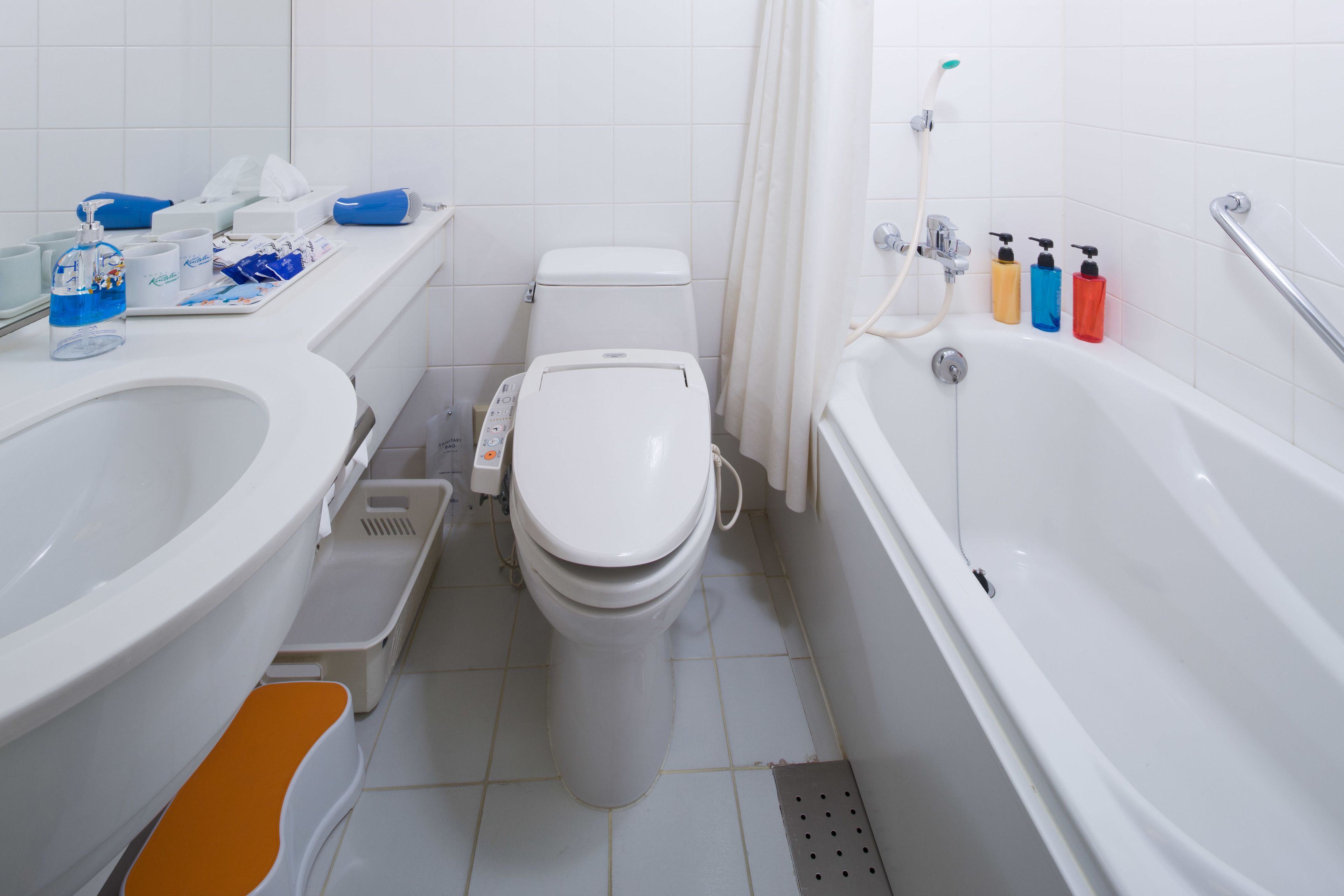 combined shower/bathtub, free toiletries, hair dryer, slippers