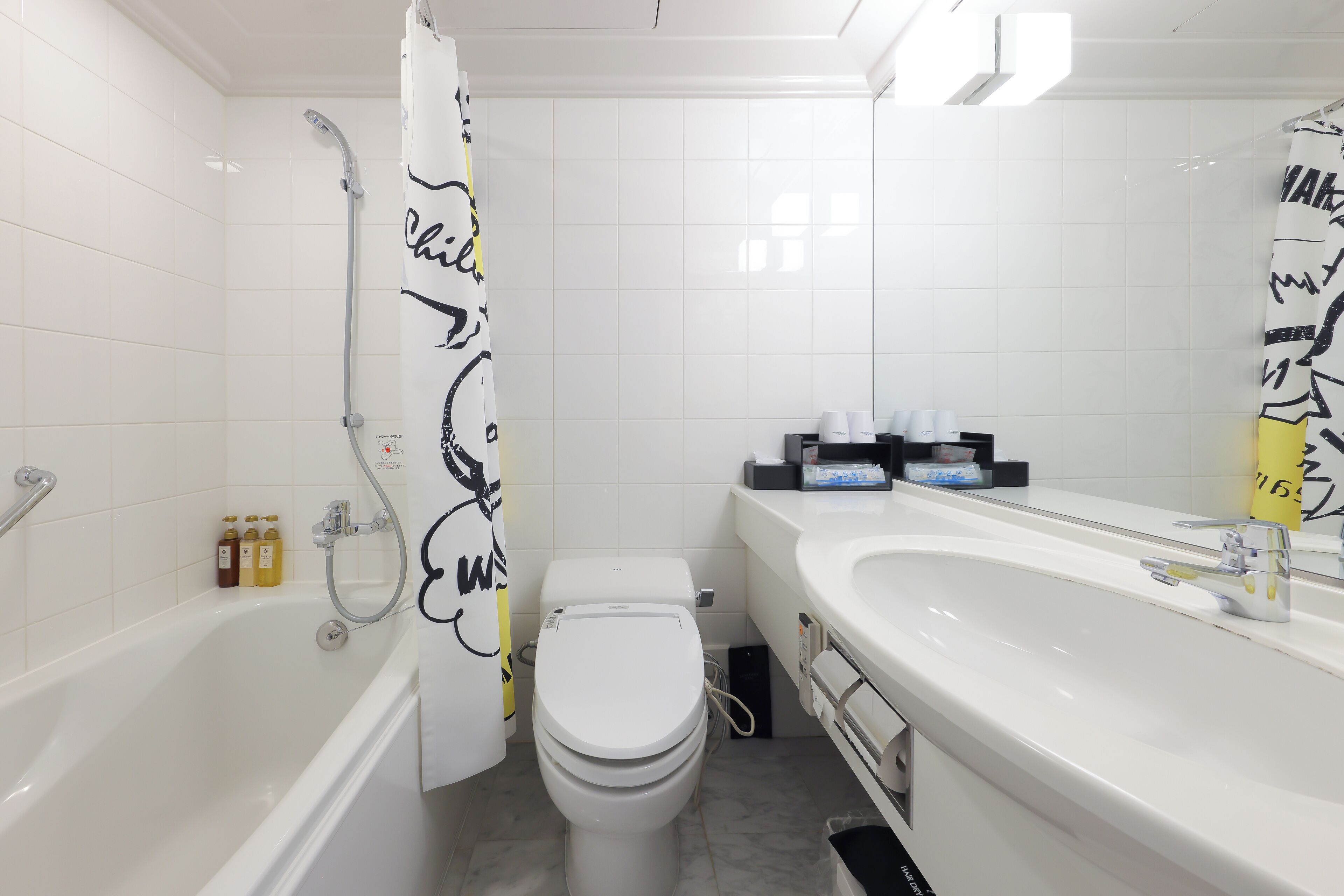 combined shower/bathtub, free toiletries, hair dryer, slippers