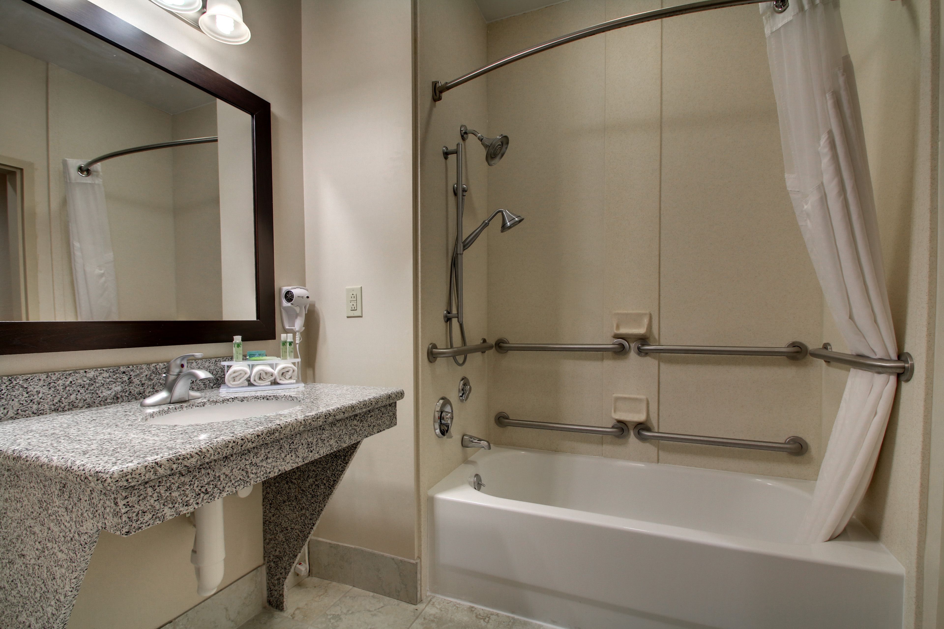 suite, 1 king bed, accessible (accessible tub) | bathroom | combined shower/bathtub, free toiletries, hair dryer, towels
