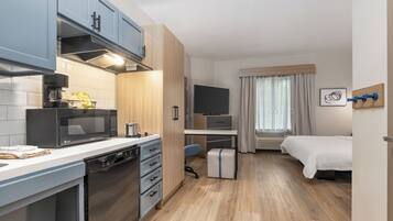 Desk, laptop workspace, blackout curtains, iron/ironing board