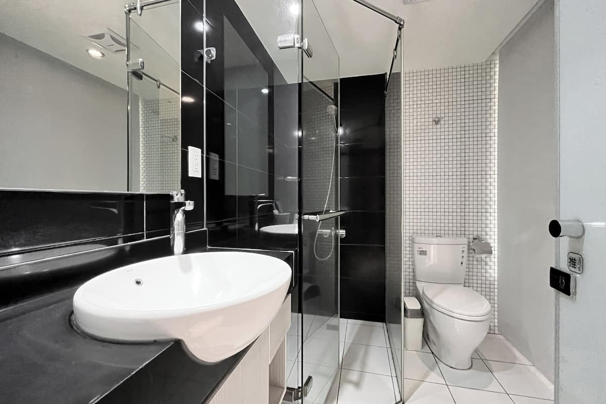 superior double room | bathroom | shower, rainfall showerhead, hair dryer, towels
