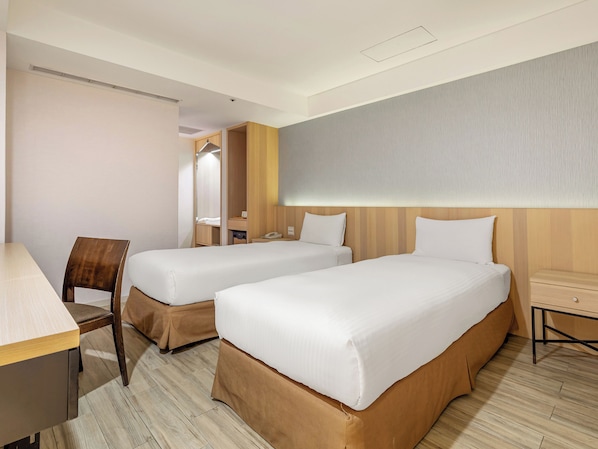Standard Twin Room, No Windows | Down comforters, minibar, desk, blackout drapes