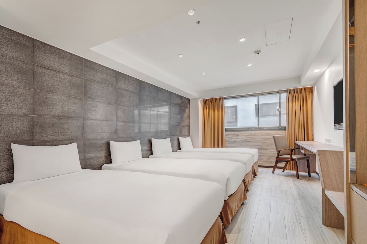 Superior Quadruple Room | Down comforters, minibar, desk, blackout drapes