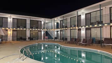Seasonal outdoor pool, open 9:00 AM to 10:00 PM, pool loungers