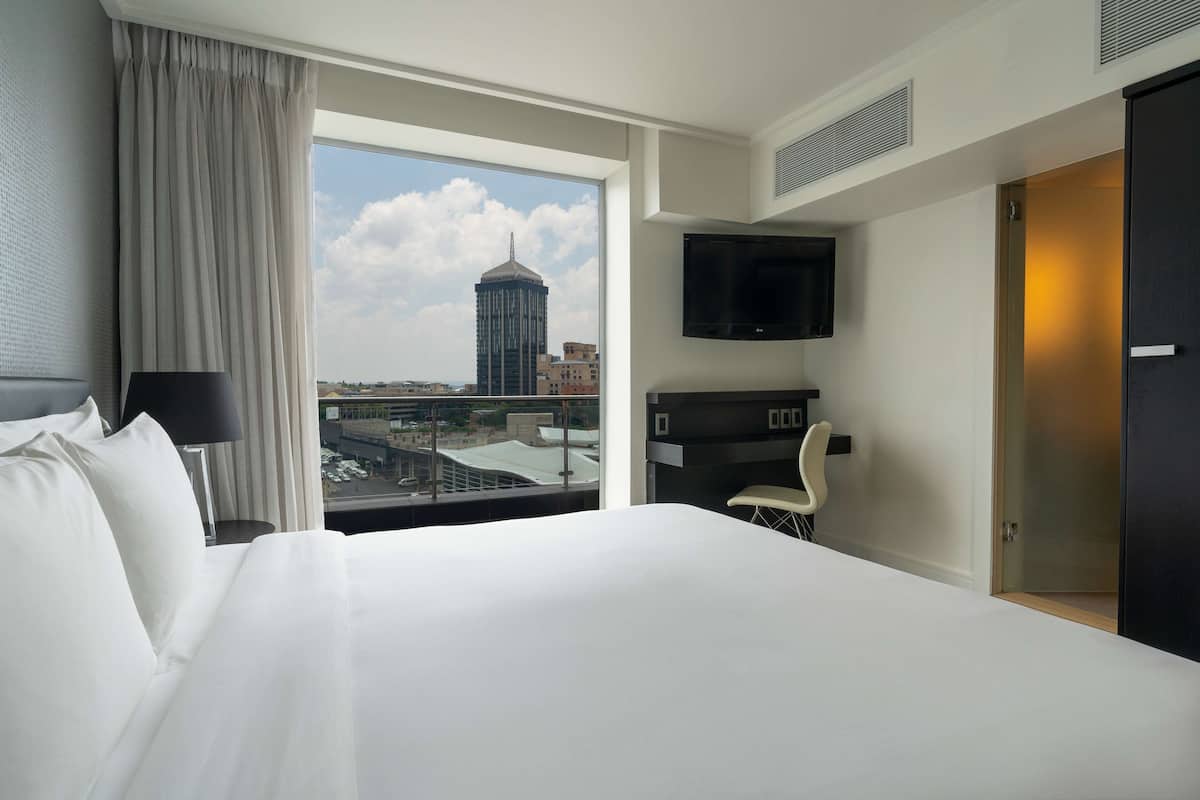 Suite, Club Lounge Access, City View (Balcony) | Premium bedding, minibar, in-room safe, desk