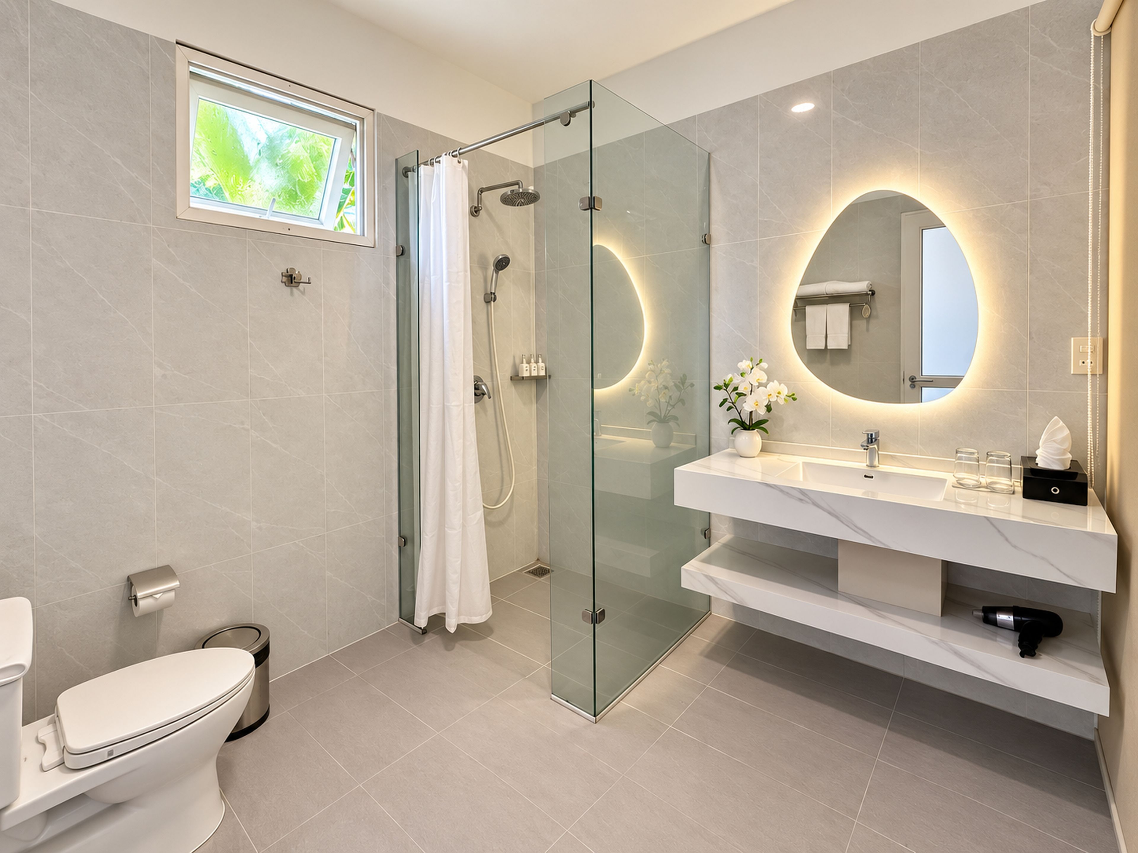 A modern bathroom with a glass-enclosed shower, a toilet, a vanity with a mirror, and a window providing natural light.