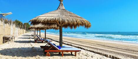 Outdoor pool, pool umbrellas, sun loungers