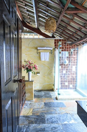 Grand Bungalow, Garden View | Bathroom | Shower, free toiletries, hair dryer, slippers