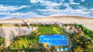 Outdoor pool, pool umbrellas, sun loungers