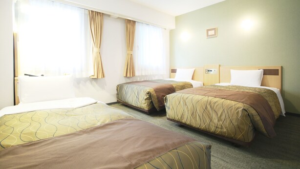 A hotel room with two beds, a large window with curtains, and a small picture on the wall. - Hotel Grand City (Tokyo)