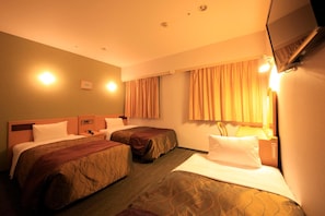 A hotel room with two beds, a flat-screen TV mounted on the wall, and a window with curtains. - Hotel Grand City (Tokyo)